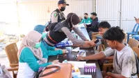 Antisipasi Lonjakan Kasus ISPA Akibat Asap Karhutla, Polres Tanah Laut Gelar Bakti Kesehatan Gratis