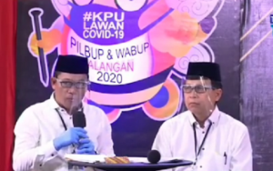 Abdul Hadi dan Supiani saat debat kandidat. (tangkapan layar TV Balangan)