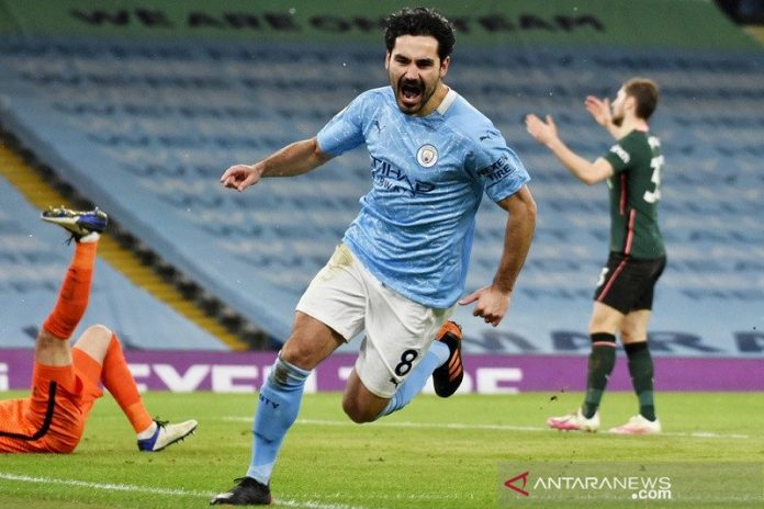 Gelandang Manchester City Ilkay Gundogan merayakan golnya ke gawang Tottenham Hotspur dalam lanjutan Liga Inggris di Stadion Etihad, Manchester, Inggris, Sabtu (13/2/2021) waktu setempat. (ANTARA/REUTERS/POOL/Rui Vieira)