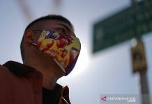 Warga AS Kemungkinan Masih Harus Pakai Masker Tahun 2022