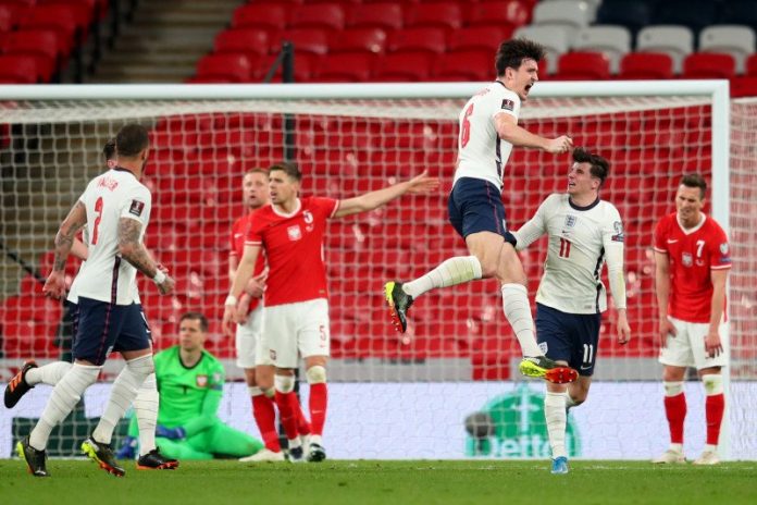 Harry Maguire menciptakan gol ketika Inggris menang 2-1 melawan Polandia dalam laga Kualifikasi Piala Dunai 2022 di Stadion Wembley, London, Inggris, 31 Maret 2021. (Pool via REUTERS/CATHERINE IVILL)