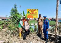 Sat Polairud dan BPBD Kota Banjarmasin Pasang Spanduk 'Awas Ada Buaya' di Sungai Pelambuan