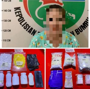 Tersangka MA dan barang bukti pil putih dan kuning yang diamankan Satresnakorba Polres Tanah Bumbu. (wartabanjar.com - Ist. Humas)