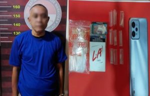 Tersangka E dan barang bukti yang diamankan Satres Narkoba Polres Tanah Laut. (wartabanjar.com - Ist. Humas Polres Tala)