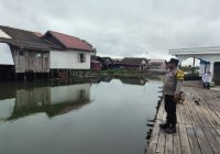 Antisipasi Banjir, Polres Tala Pantau Debit Air Desa Benua Raya Bati-Bati