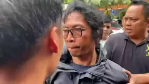 Nanang Irawan alias Nanang Gimbal, tersangka pembunuh Sandy Permana, diamankan polisi. (Beritasatu.com)