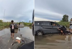 Mobil terperosok saat melewati ruas jalan yang rusak dari Margasari arah Kandangan. (wartabanjar.com - Ist. @wargabanua.official)