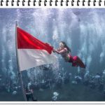 BERKOSTUM MERMAID! Gubernur Malut Sherly Tjoanda Meriahkan HUT RI dengan Pengibaran Bendera Bawah Laut!