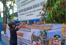 Waspadai Banjir Rob dan Hujan Ekstrem, BPBD Kota Banjarmasin Pasang Spanduk Peringatan di Sejumlah Titik